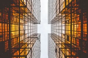 glass skyscraper building orange city wealth asset bank